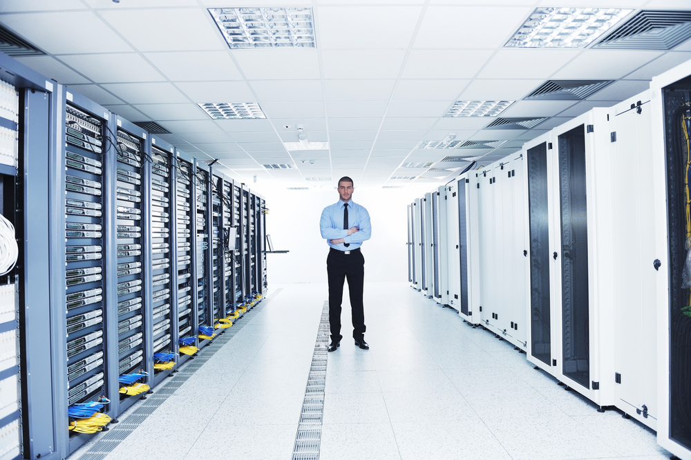 young handsome business man  engeneer in datacenter server room-3